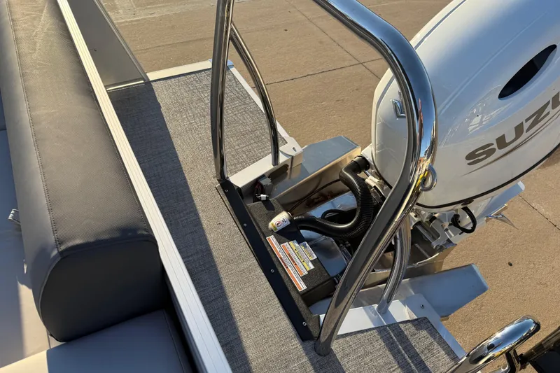 Slide: The Image of 2026 Avalon Catalina Entertainer boat with Suzuki outboard motor, rear seating, and stainless steel railing. - 28