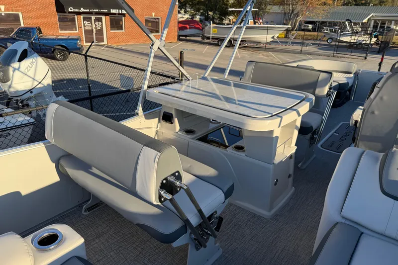 Slide: The Image of 2026 Avalon Catalina Entertainer boat interior with seating and table setup. - 29