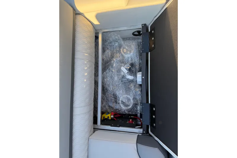 Slide: The Image of Storage compartment in 2026 Avalon Catalina Entertainer boat, featuring wrapped components. - 32