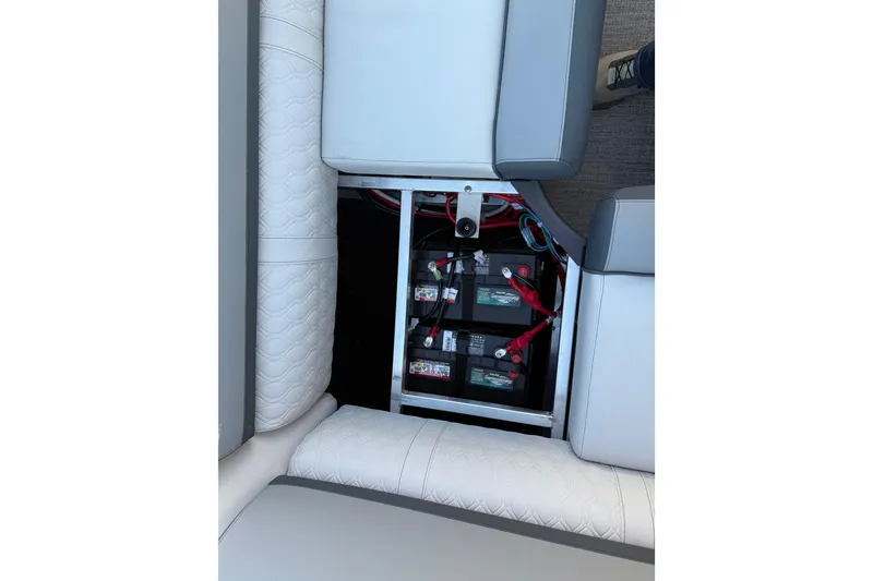Slide: The Image of 2026 Avalon Catalina Entertainer boat battery compartment with seating and wiring. - 33