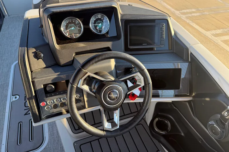 Slide: The Image of Steering console of 2026 Avalon Catalina Entertainer boat with modern controls and displays. - 34