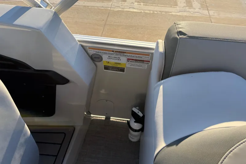 Slide: The Image of Interior of 2026 Avalon Catalina Entertainer boat showing seating and capacity label. - 39