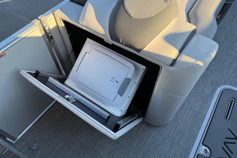 Slide: The Image of 2026 Avalon Catalina Entertainer boat seat with integrated storage compartment open. - 43