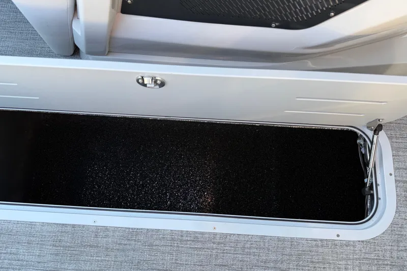Slide: The Image of Storage compartment in 2026 Avalon Catalina Entertainer boat, featuring sleek design and secure latch. - 46