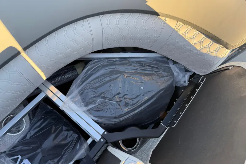 Slide: The Image of Storage compartment in 2026 Avalon Catalina Entertainer boat with cushioned seating. - 48