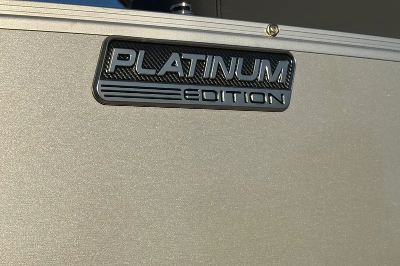 Slide: The Image of 2026 Avalon Catalina Entertainer Platinum Edition badge on metallic surface. - 55