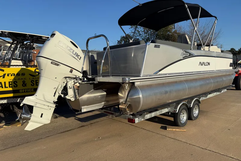 Slide: The Image of 2026 Avalon Catalina Entertainer pontoon boat with Suzuki outboard motor on trailer. - 7