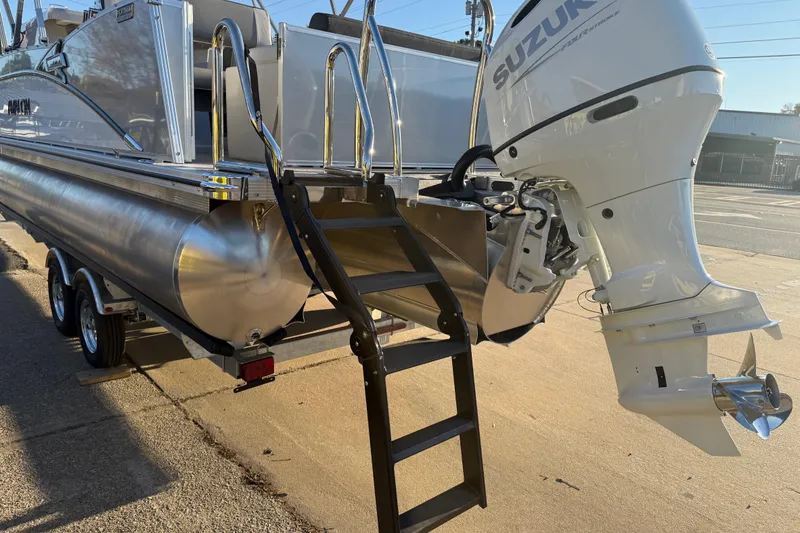 Slide: The Image of 2026 Avalon Catalina Entertainer pontoon boat with Suzuki outboard motor and ladder. - 8
