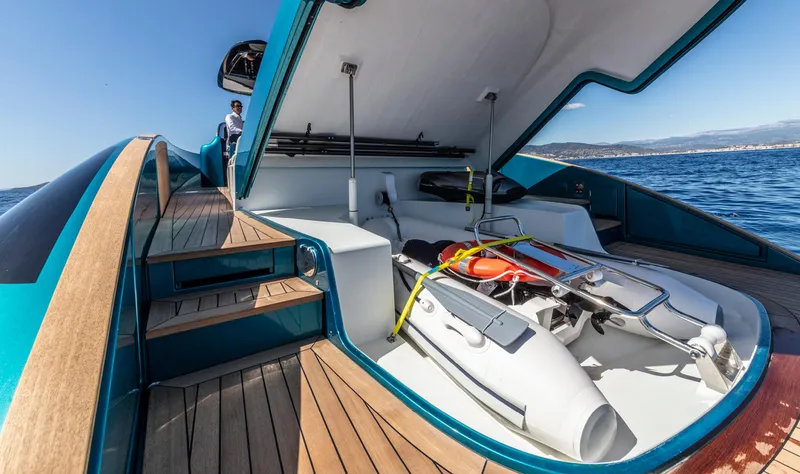 Slide: The Image of 2024 Solaris Power 48 OPEN yacht with open storage compartment and tender. - 10