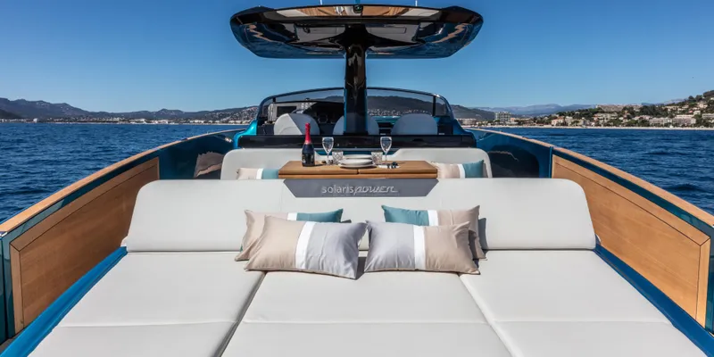 Slide: The Image of Luxurious 2024 Solaris Power 48 OPEN yacht with sunbathing area and scenic ocean view. - 8