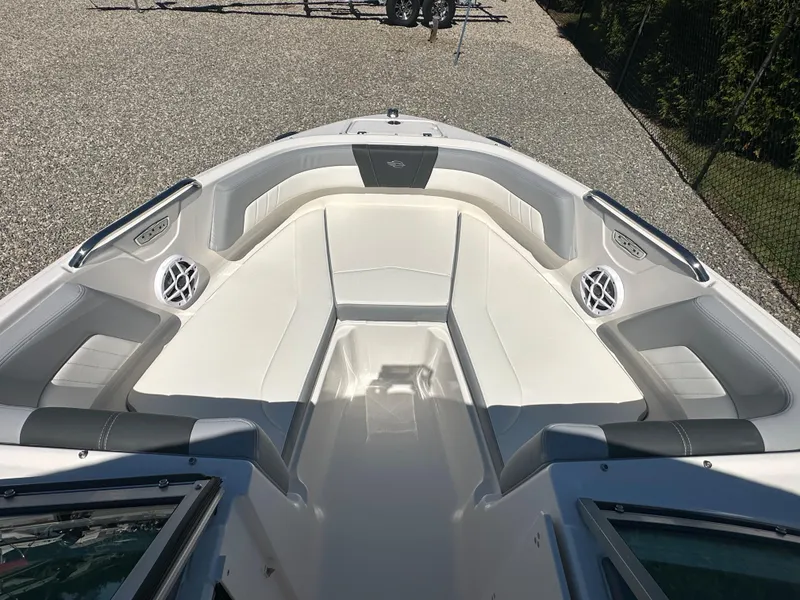 Slide: The Image of 2024 Chaparral 21 SSi OB boat interior with white and gray seating. - 5