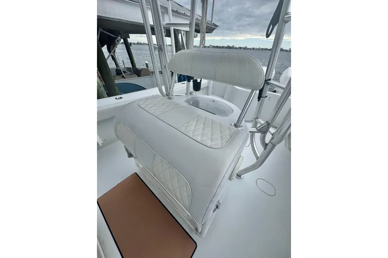 Slide: The Image of 2004 Yellowfin 36 Offshore boat dashboard with dual Raymarine displays and steering wheel. - 10