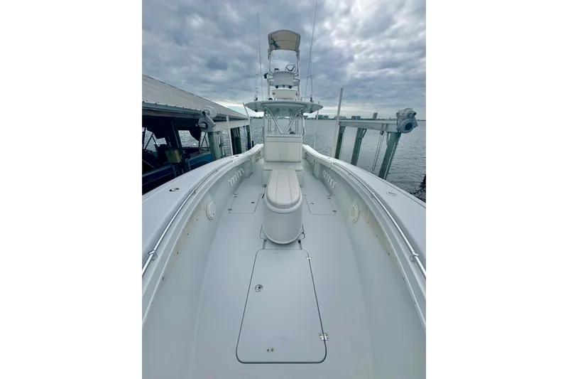 Slide: The Image of 2004 Yellowfin 36 Offshore boat on calm water, sunny day, clear blue sky. - 7