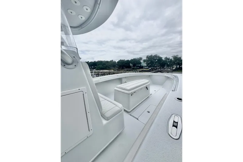 Slide: The Image of 2004 Yellowfin 36 Offshore boat on water, featuring triple outboard engines. - 8