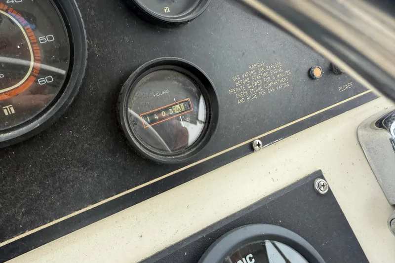 Slide: The Image of 1986 Silverton 34 Convertible dashboard with hour meter reading 1403.4 hours. - 10