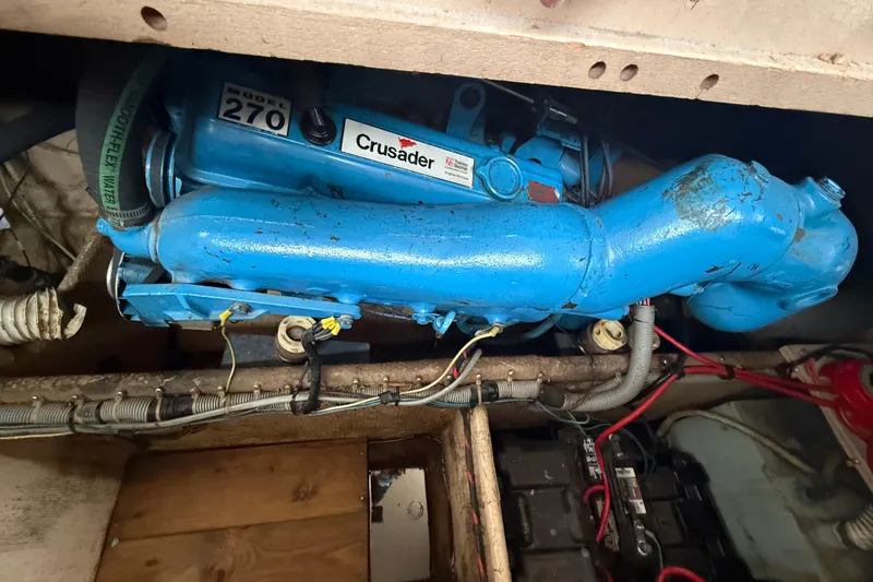 Slide: The Image of 1986 Silverton 34 Convertible engine compartment with blue Crusader Model 270 engine. - 14