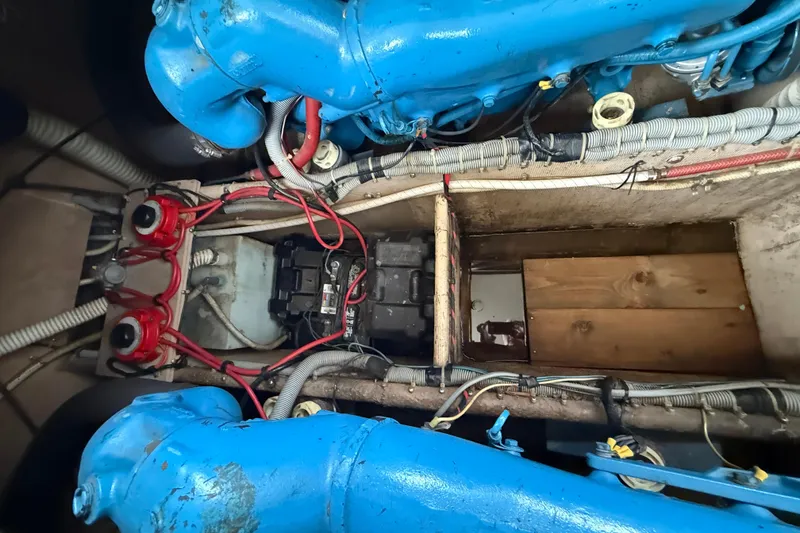 Slide: The Image of Engine compartment of a 1986 Silverton 34 Convertible with blue engine components. - 16