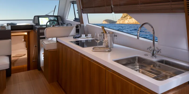 Slide: The Image of Interior of 2024 Solaris Power 48 Lobster yacht with modern kitchen and ocean view. - 11