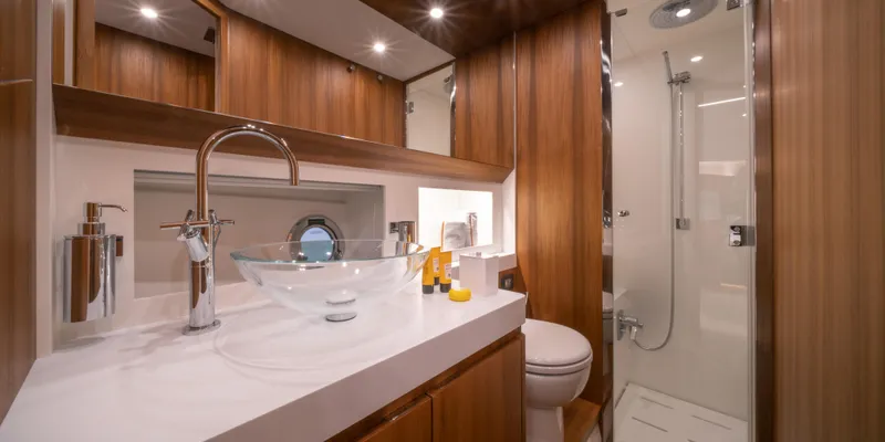 Slide: The Image of Luxurious bathroom in 2024 Solaris Power 48 Lobster yacht with modern fixtures and glass sink. - 12