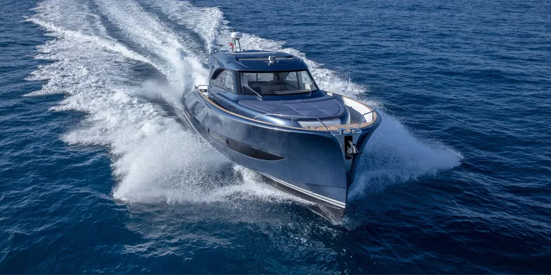 Slide: The Image of 2024 Solaris Power 48 Lobster yacht cruising on open water. - 3