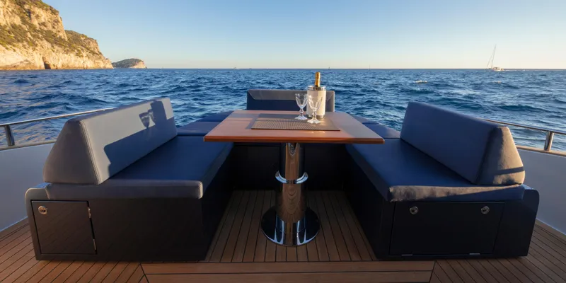 Slide: The Image of 2024 Solaris Power 48 Lobster yacht with elegant outdoor seating and ocean view. - 7