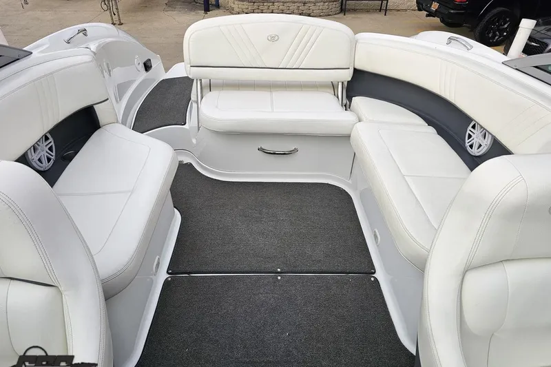 Slide: The Image of 2007 Cobalt 252 boat interior with white seating and gray carpet. - 100