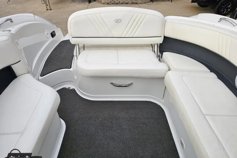 Slide: The Image of 2007 Cobalt 252 boat interior with white leather seating and gray carpet. - 101