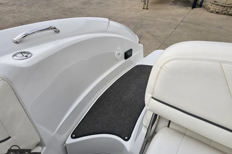 Slide: The Image of 2007 Cobalt 252 boat interior with white seating and black mat. - 104