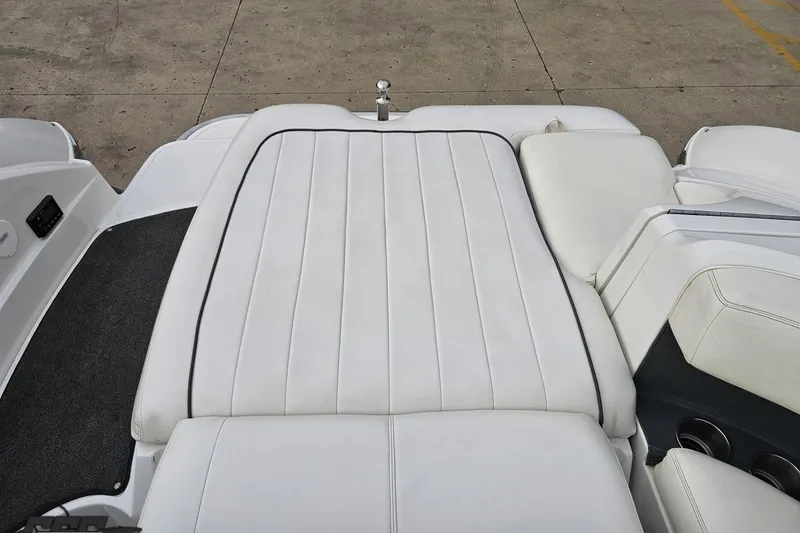 Slide: The Image of 2007 Cobalt 252 boat with white cushioned seating and sleek design. - 105