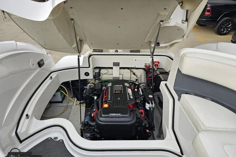 Slide: The Image of Open engine compartment of a 2007 Cobalt 252 boat, showcasing the engine details. - 107