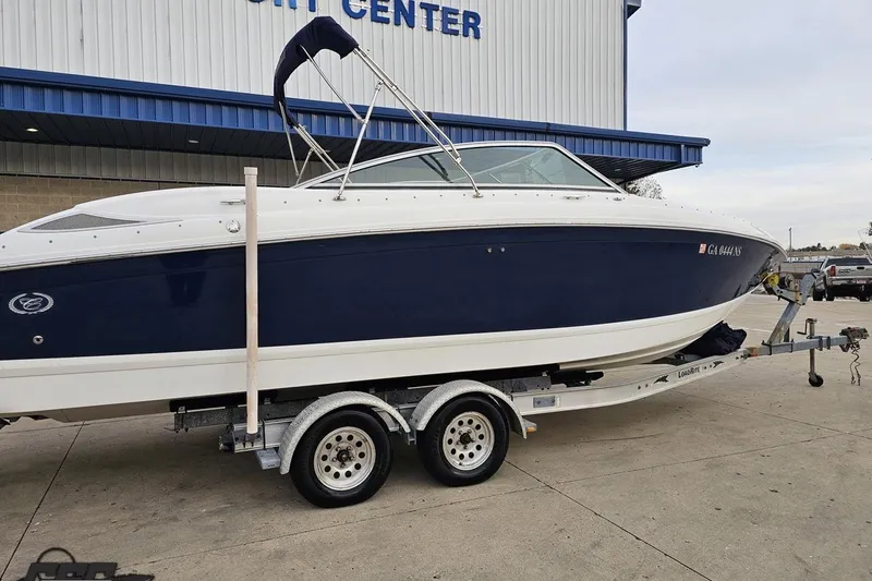 Slide: The Image of 2007 Cobalt 252 boat on trailer outside a marine center. - 11