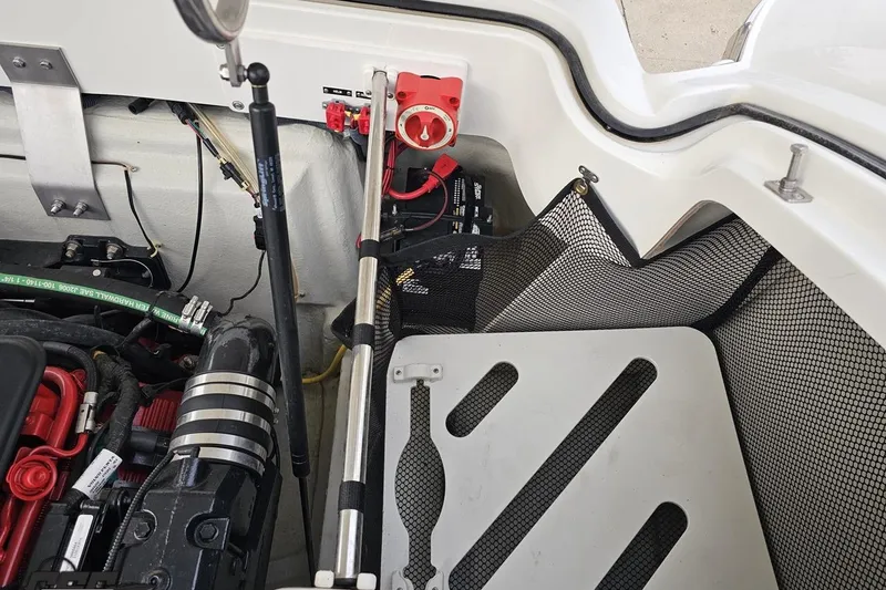 Slide: The Image of Engine compartment of a 2007 Cobalt 252 boat, featuring battery and wiring components. - 112