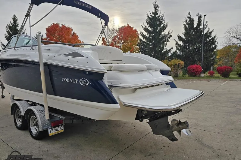 Slide: The Image of 2007 Cobalt 252 boat on trailer, autumn trees in background. - 27