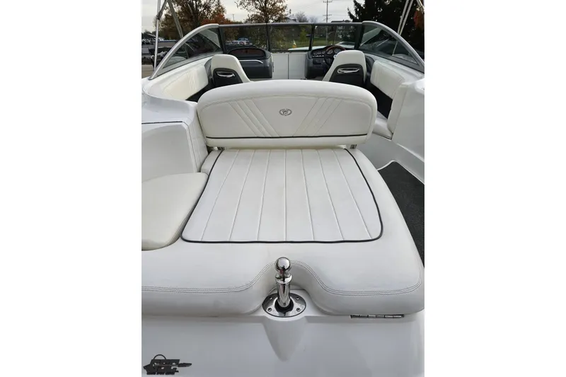 Slide: The Image of 2007 Cobalt 252 boat interior with white leather seating and sleek design. - 47