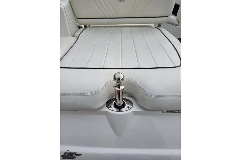 Slide: The Image of White leather seating on a 2007 Cobalt 252 boat, featuring a stainless steel ski tow. - 48