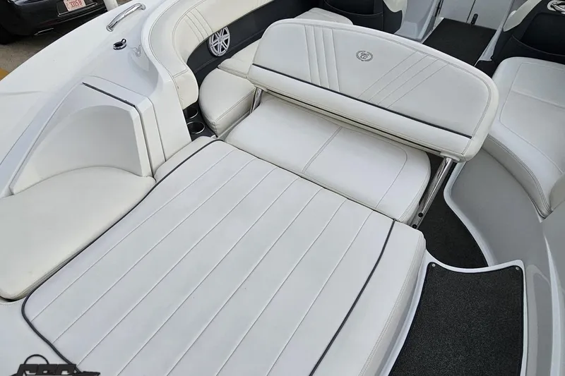 Slide: The Image of 2007 Cobalt 252 boat interior with white leather seating and sleek design. - 51
