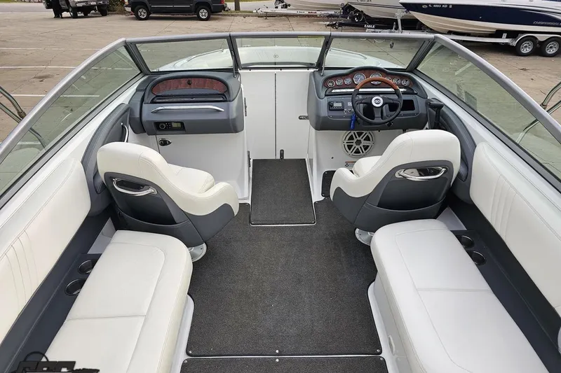 Slide: The Image of 2007 Cobalt 252 boat interior with white seating and modern dashboard design. - 57