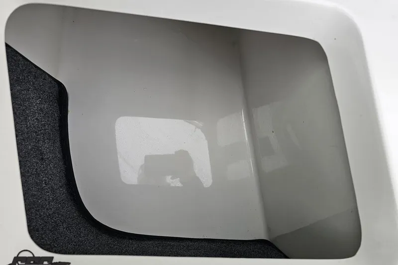 Slide: The Image of Storage compartment of a 2007 Cobalt 252 boat, featuring a clean interior. - 67