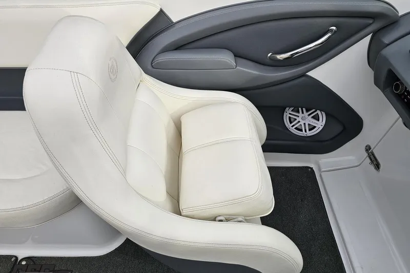 Slide: The Image of 2007 Cobalt 252 boat interior with white leather seat and speaker detail. - 69