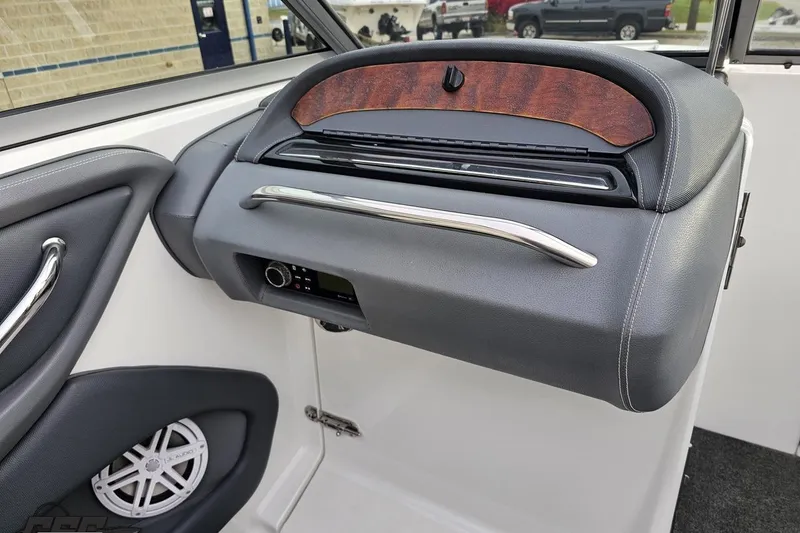 Slide: The Image of 2007 Cobalt 252 boat interior dashboard with speaker and control panel. - 71