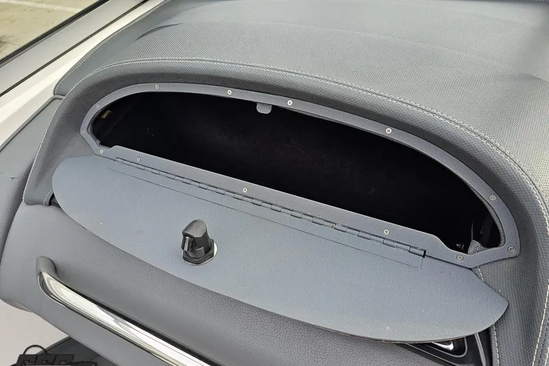 Slide: The Image of Open glove compartment in 2007 Cobalt 252 boat, showcasing interior storage space. - 72