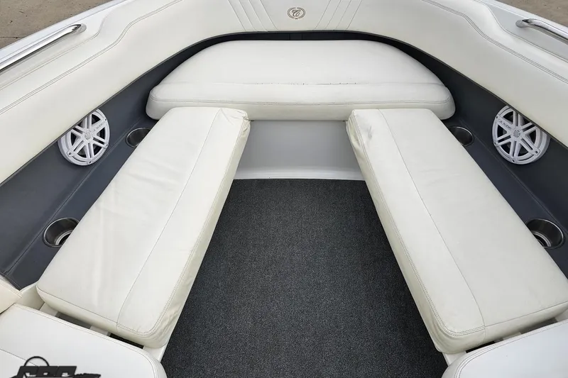 Slide: The Image of Interior of 2007 Cobalt 252 boat with white seating and speakers. - 89