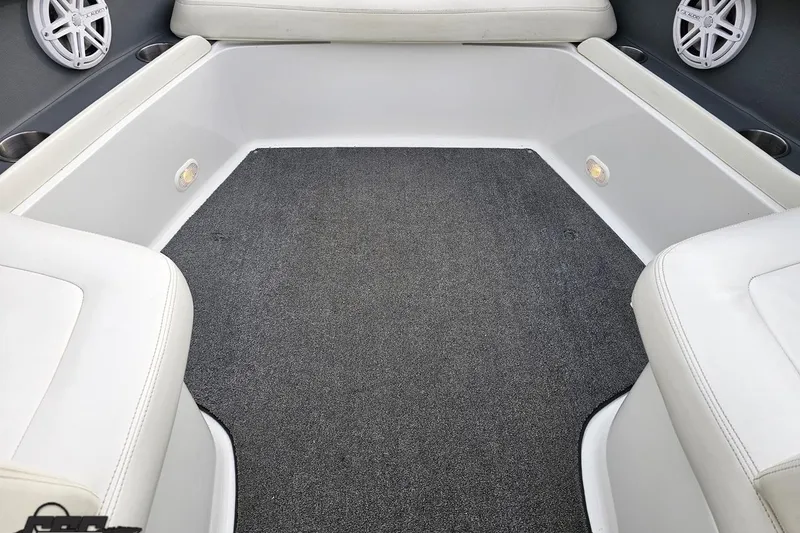 Slide: The Image of Interior of a 2007 Cobalt 252 boat with white seating and gray carpet. - 91