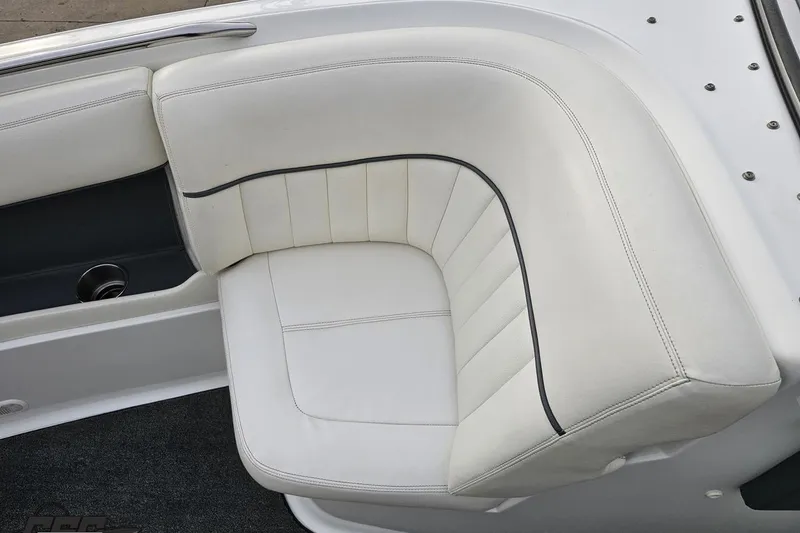 Slide: The Image of White leather seating on a 2007 Cobalt 252 boat, featuring sleek design and stitching. - 92