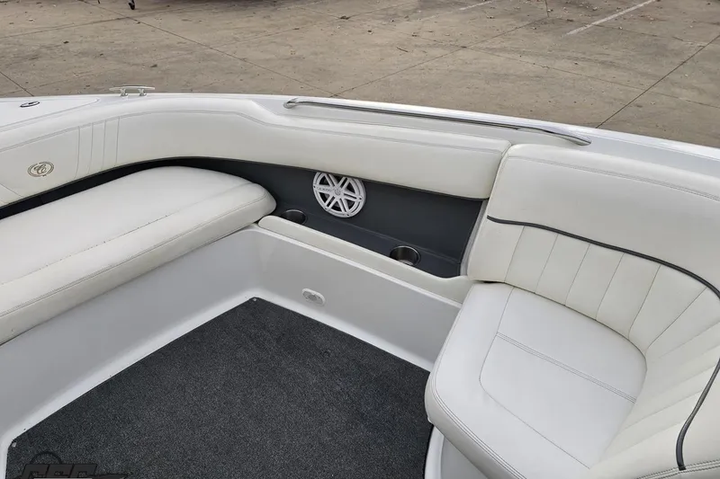 Slide: The Image of 2007 Cobalt 252 boat interior with white leather seating and speaker detail. - 93