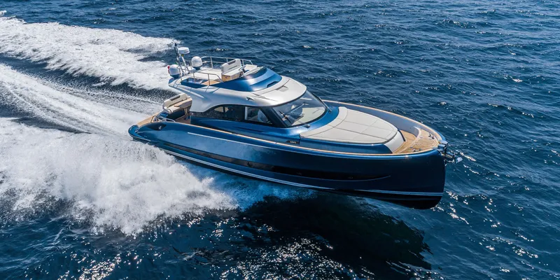 The Image of 2024 Solaris Power 48 Flybridge yacht cruising on open water. - 0
