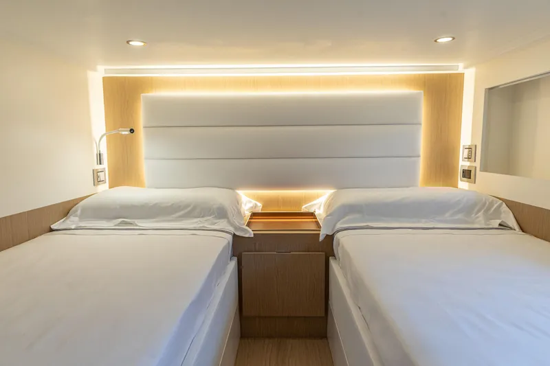 Slide: The Image of Modern twin bedroom on the 2024 Solaris Power 48 Flybridge yacht. - 15
