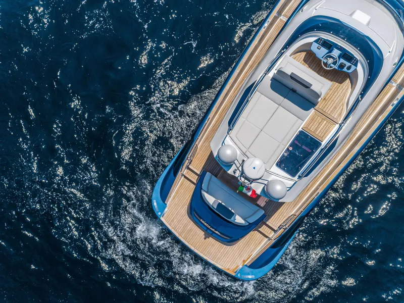 Slide: The Image of Aerial view of 2024 Solaris Power 48 Flybridge yacht cruising on the ocean. - 6