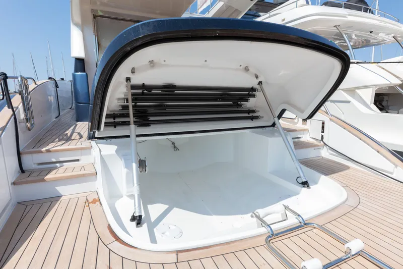 Slide: The Image of 2024 Solaris Power 48 Flybridge yacht with open storage compartment. - 7