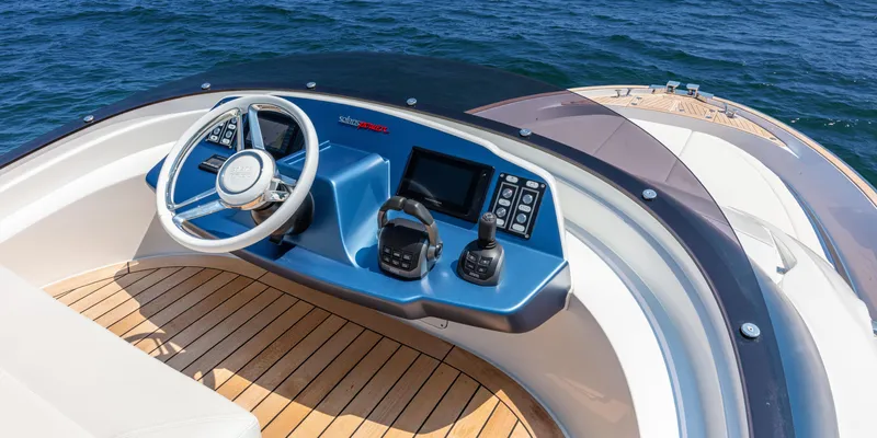 Slide: The Image of 2024 Solaris Power 48 Flybridge helm station with ocean view. - 9